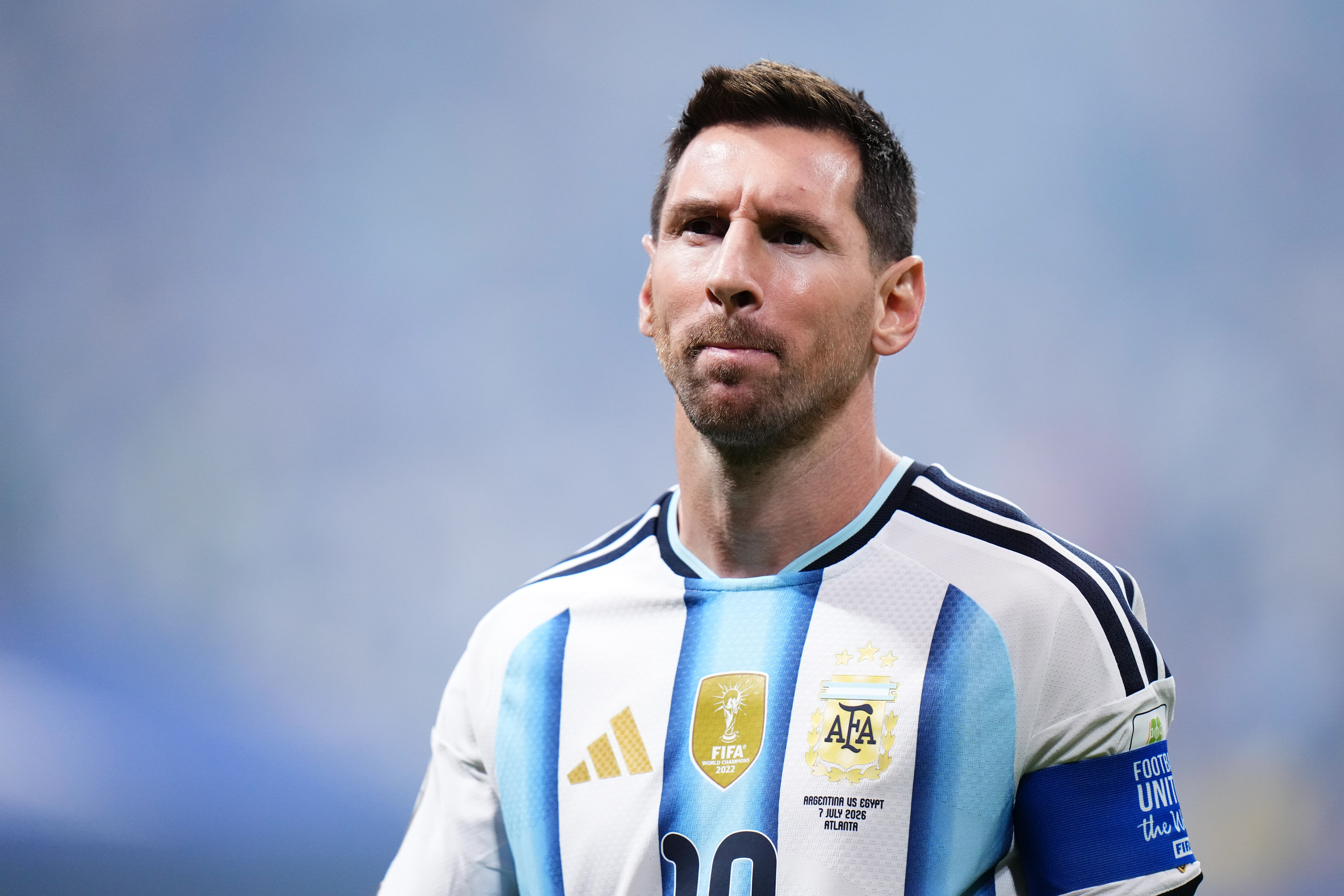 A determined Lionel Messi, captain of Argentina, looking focused amidst the electrifying atmosphere of the FIFA World Cup 2026